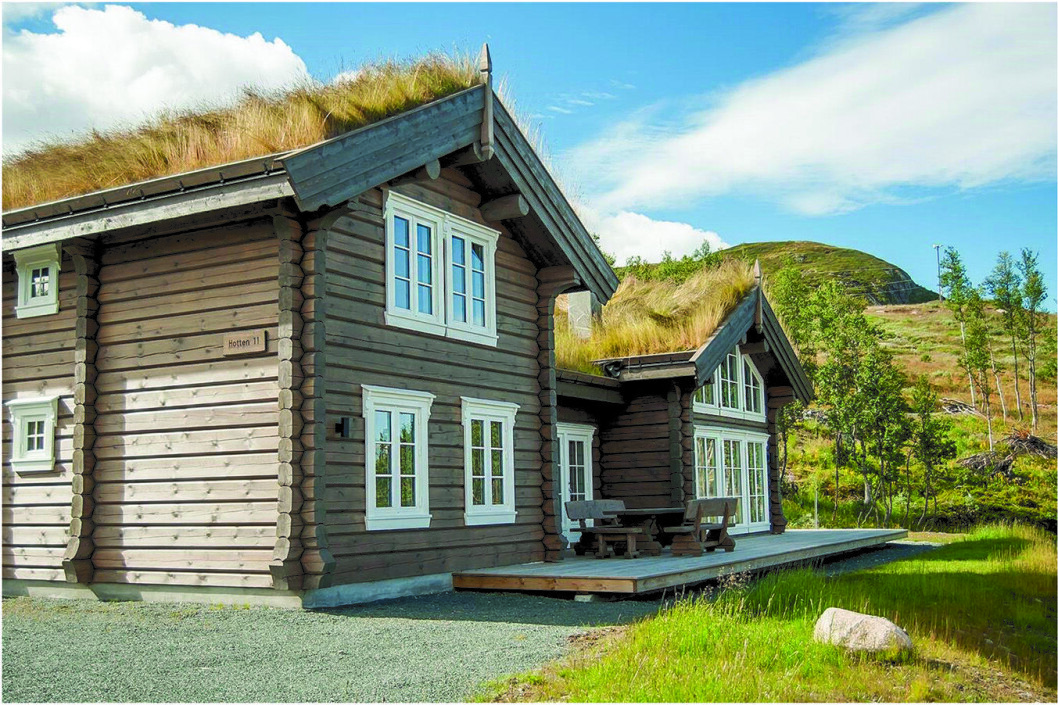 Bildet viser en fritidsbolig med laftede vegger. (Foto: Flatdal Handlaft AS) Bildet viser en fritidsbolig med laftede vegger. (Foto: Flatdal Handlaft AS)